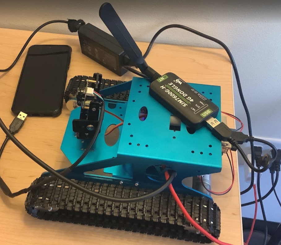 Tracked robot with a Waveshare SIM7600G-H 4G dongle attached